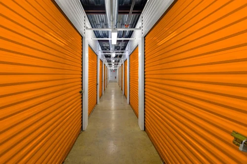 Interior of climate-controlled storage units with orange doors.